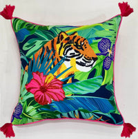 Embroidered tiger portrait among palm fronds on a throw pillow with teal piping