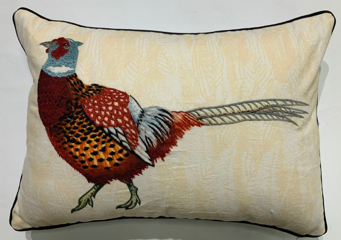 Embroidered pheasant on a lumbar throw pillow with contrast piping